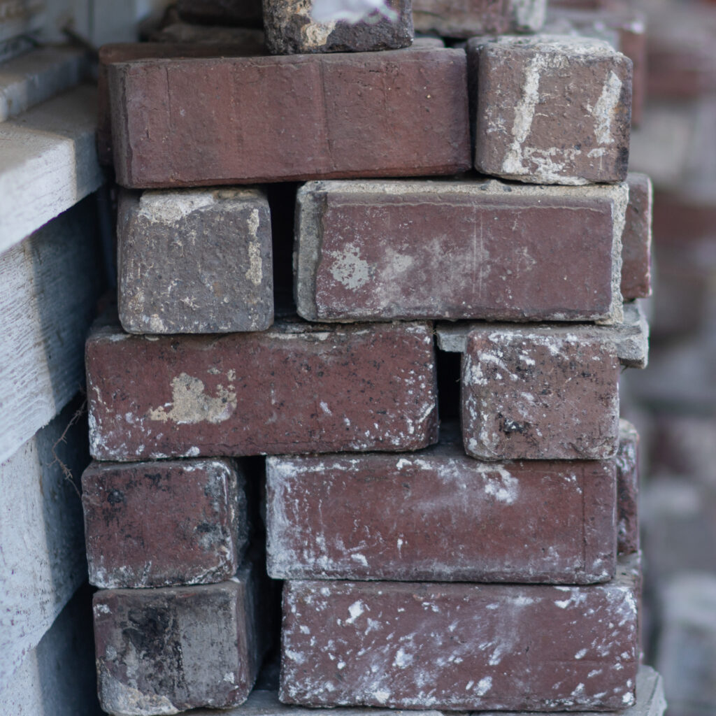 Stacked brick blocks with visible surface wear and texture variations.